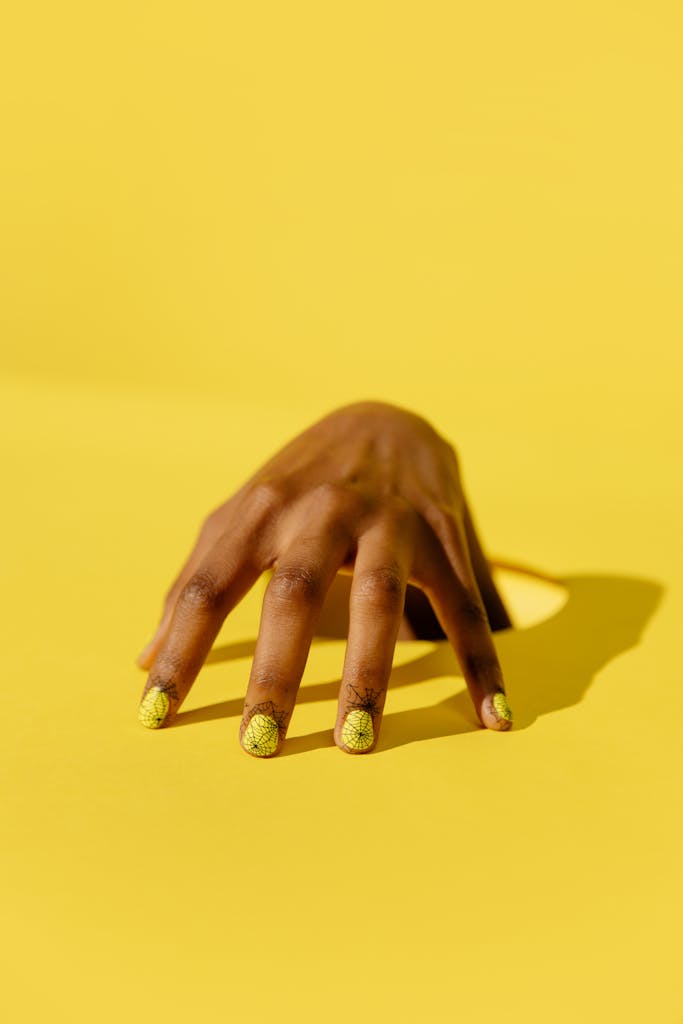 Hand in Yellow Background