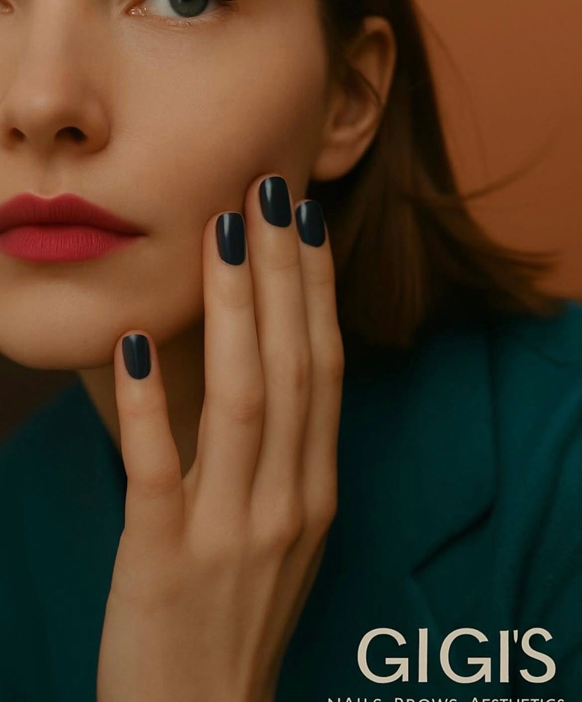 Beauty portrait with dark polished nails and red lipstick